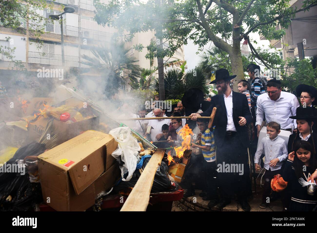 Orthodox Jews burning bread and Chametz as part of the preparations for the Passover Holiday in Bnei Brak, Israel. Stock Photo