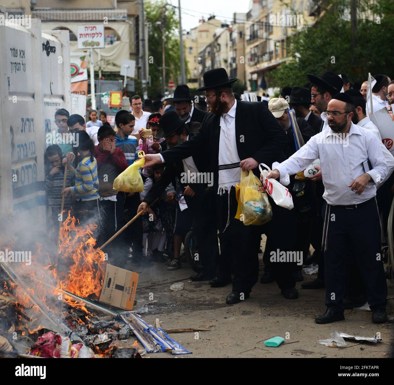 Orthodox Jews burning bread and Chametz as part of the preparations for the Passover Holiday in Bnei Brak, Israel. Stock Photo