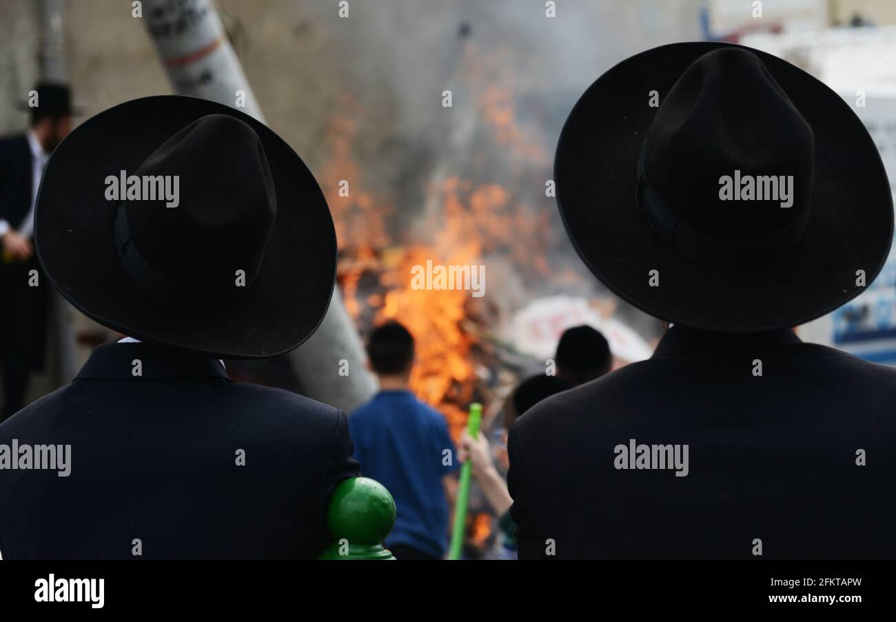 Orthodox Jews burning bread and Chametz as part of the preparations for the Passover Holiday in Bnei Brak, Israel. Stock Photo