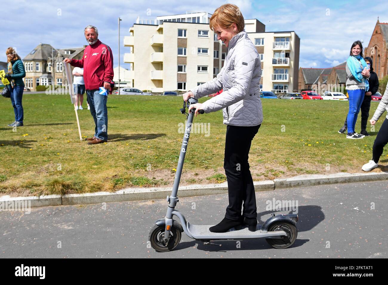 File photo dated 02/05/21 of Scotland's First Minister and leader of the Scottish National Party (SNP), Nicola Sturgeon trying out a scooter in Troon during campaigning for the Scottish Parliamentary election. Issue date: Tuesday May 4, 2021. Stock Photo