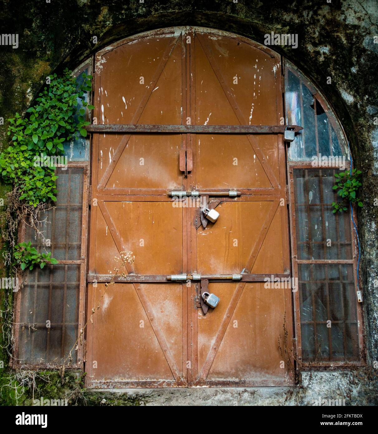 A shot of metal sheet gate locked during corona pandemic in India. total lock down. Stock Photo