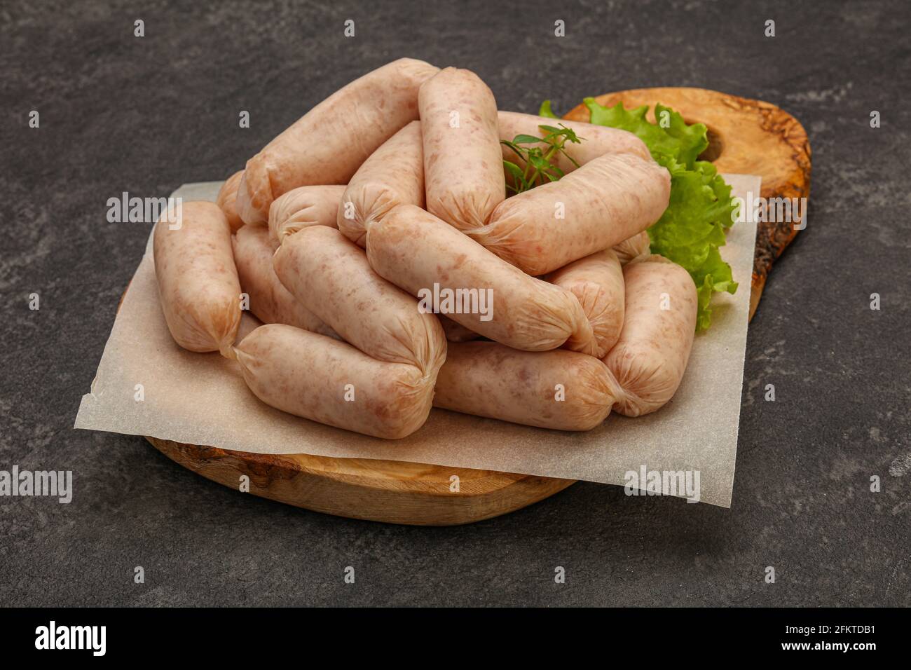 Raw natural chicken baby sausages for roast Stock Photo Alamy