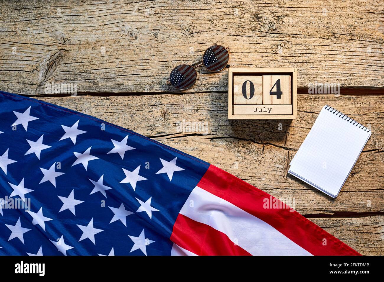 Wooden calendar with numbers on which the image of the date of American ...