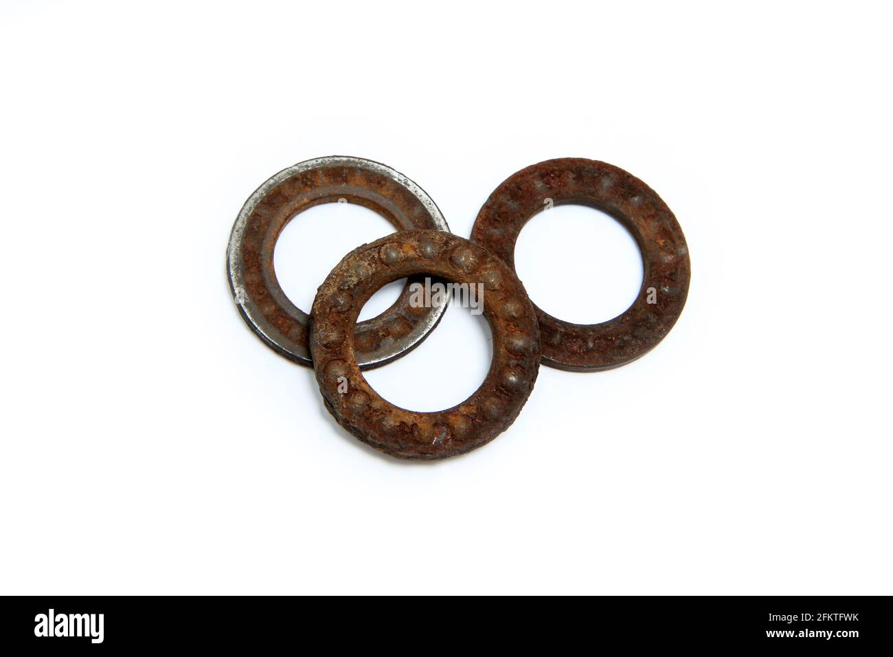 The old broken bearing, with the balls completely overgrown by rust. Disintegrated into three