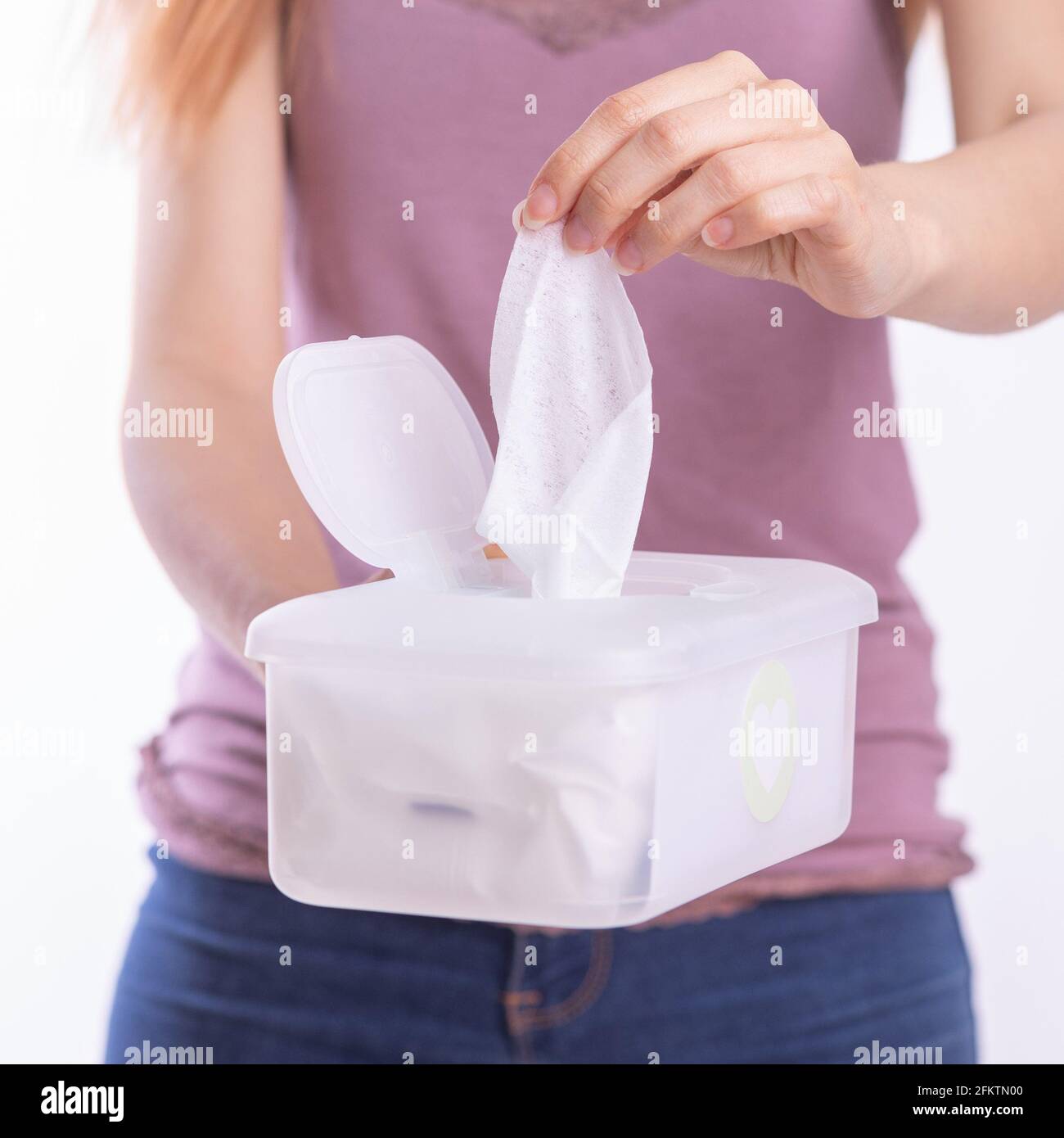 Wet wipes are universal an practical woman hand take one wipe from big