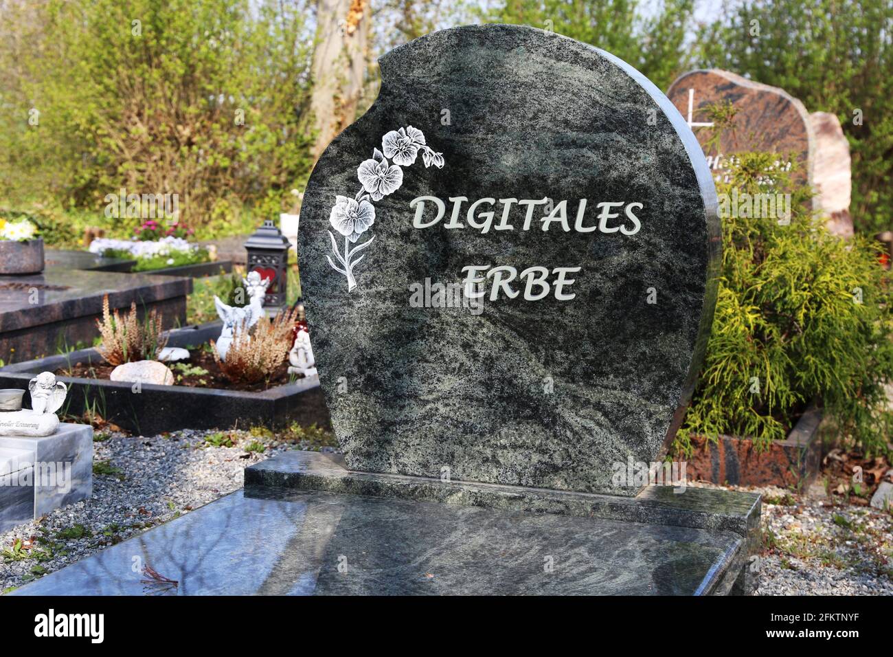 Symbol image: Gravestone with the german inscription Digitales Erbe (digital legacy). Stock Photo