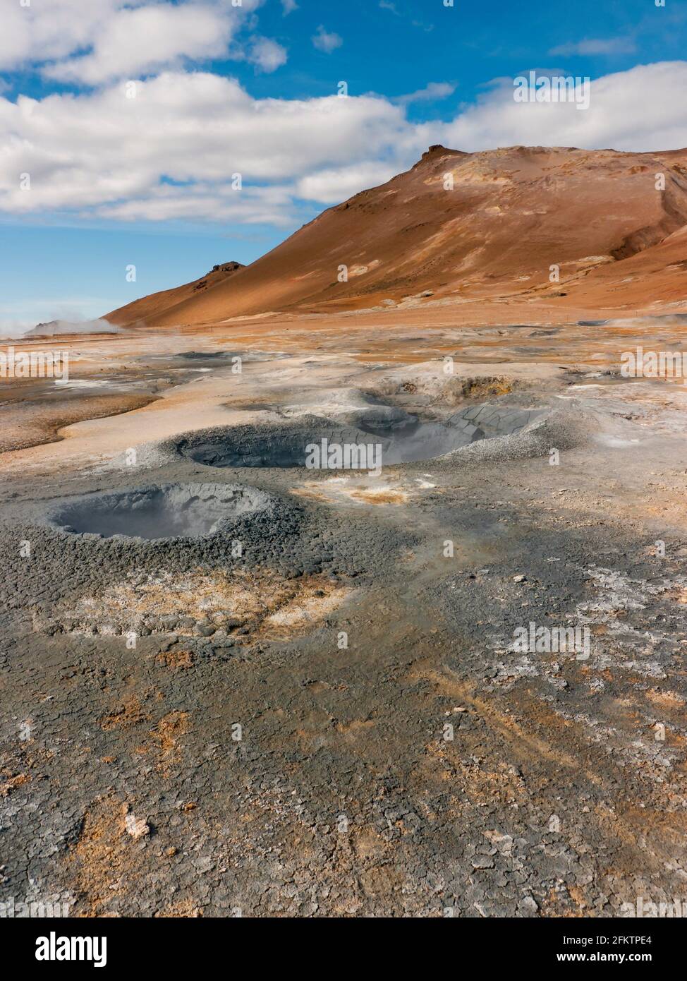 Námafjall Hverir geotermal area with boiling mudpools and steaming fumaroles. Stock Photo