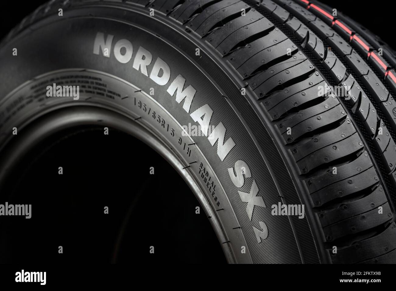 new summer tire, tread close-up on black background. Stock Photo