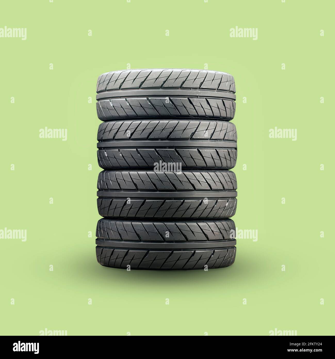 stack of summer eco-friendly green tires, square photo Stock Photo - Alamy