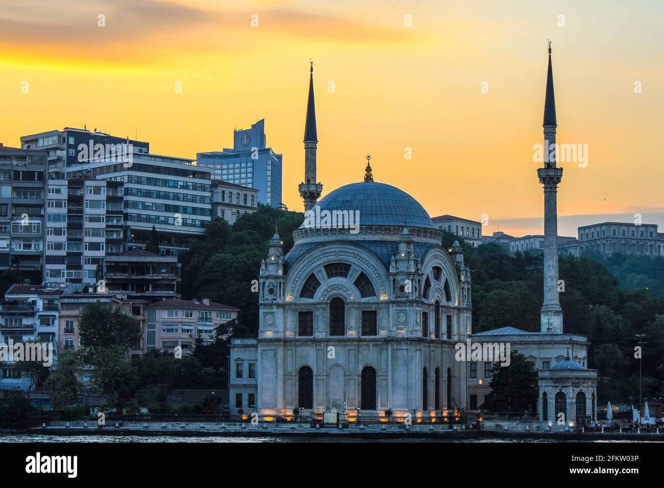 Istanbul, Turkey - May 12, 2013: View of Dolmabahce Mosque on the Waterfront at Sunset Stock Photo
