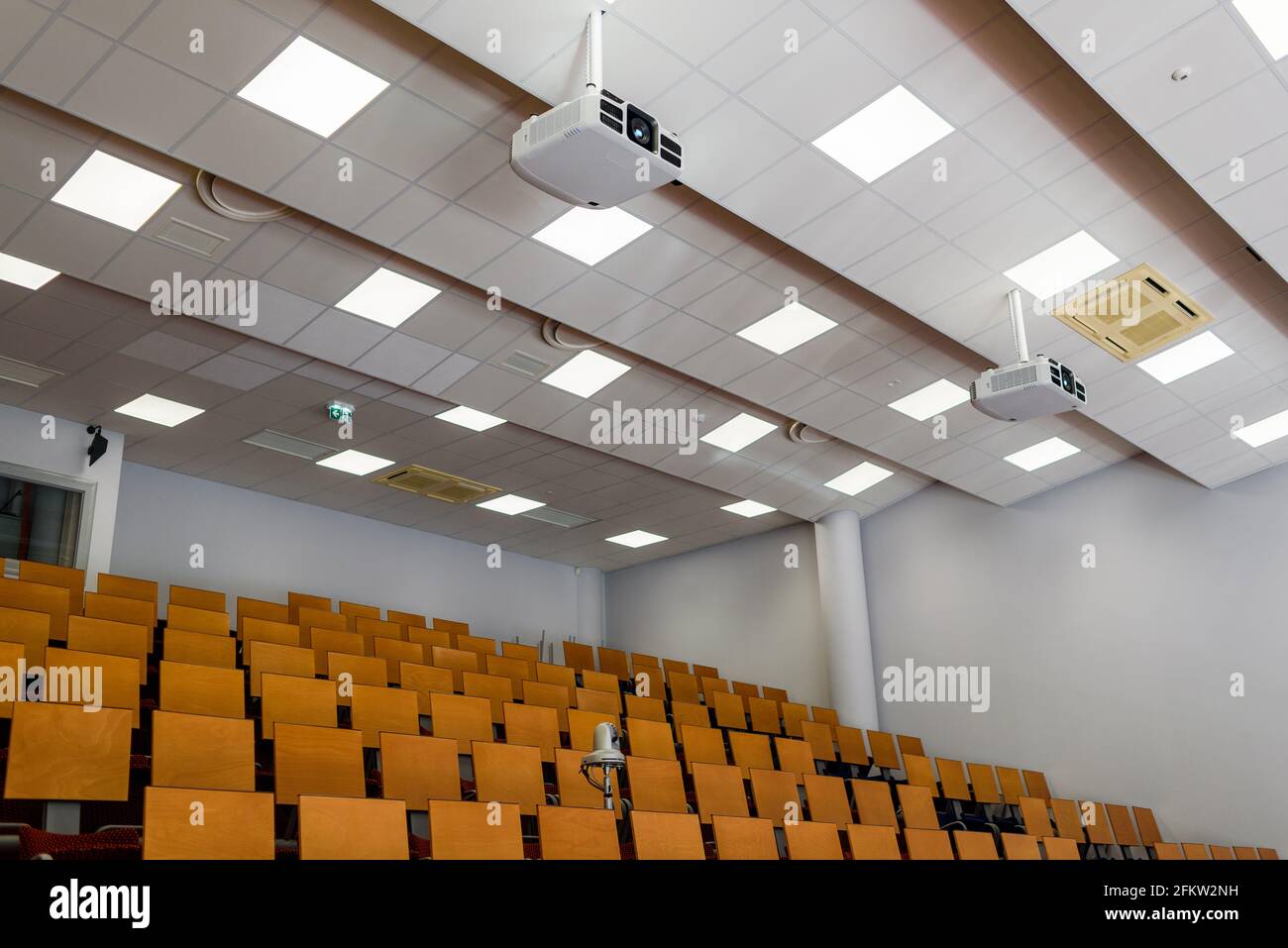 Empty university classroom with media equipment: projector, camera, audio system. For distance learning. Stock Photo