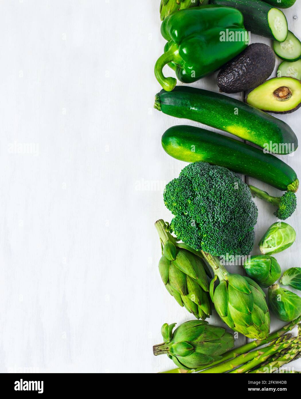 Green vegetables on a white background. Healthy food. Top view Stock ...