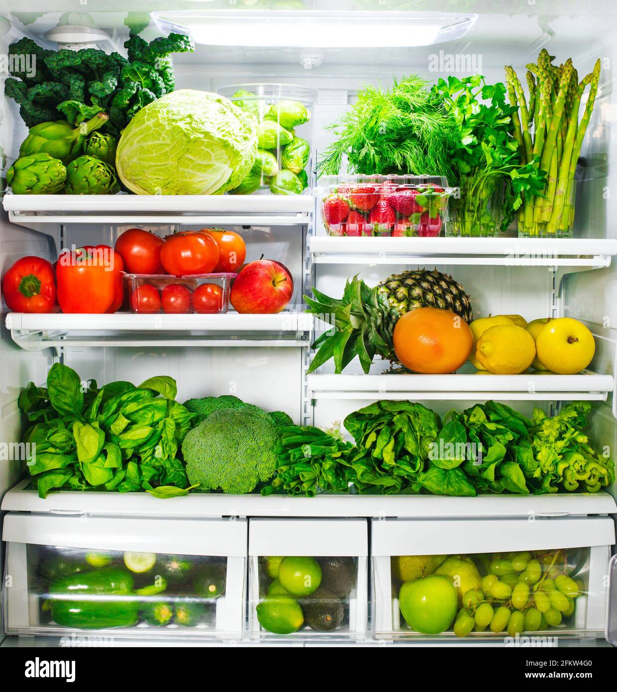 Fresh vegetables and fruits in fridge. Stock Photo