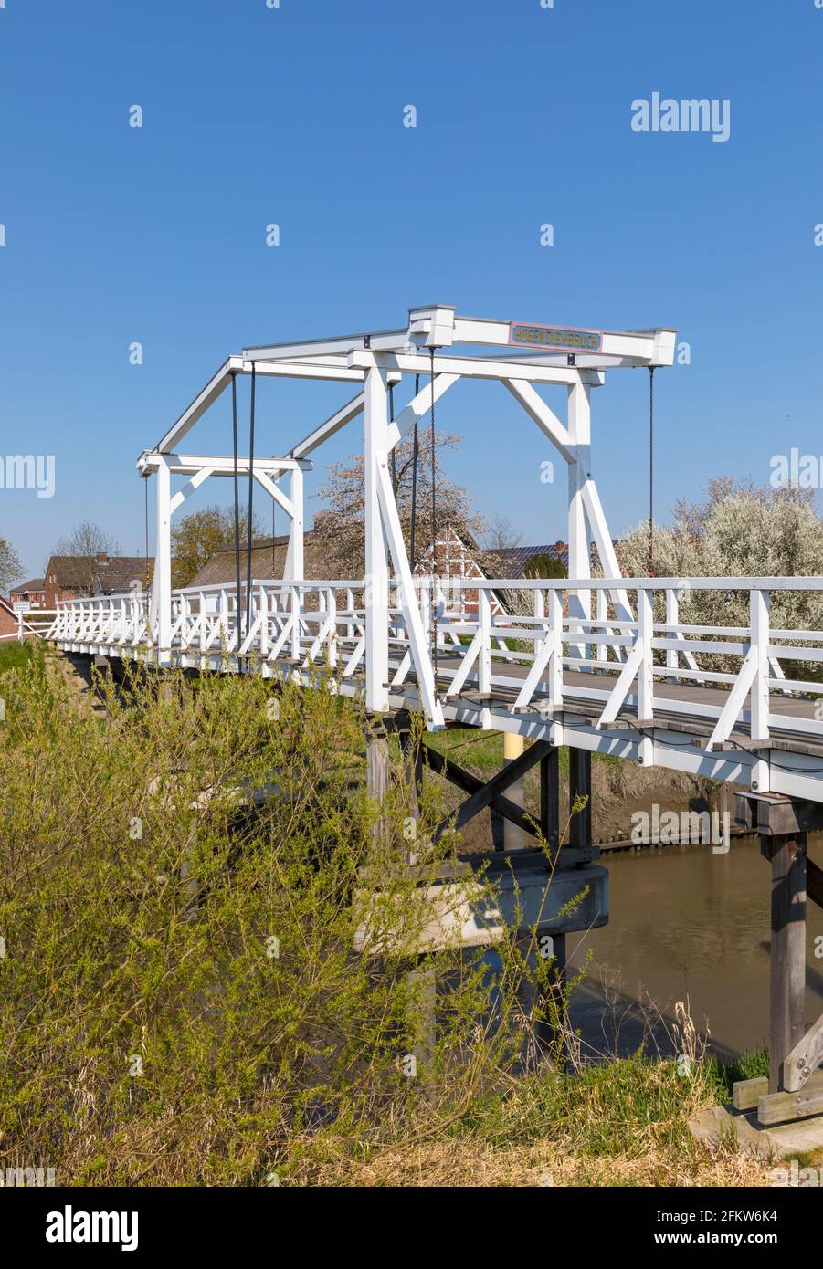 Wooden drawbridge across Lühe river at Altes Land region of Lower Saxony Stock Photo