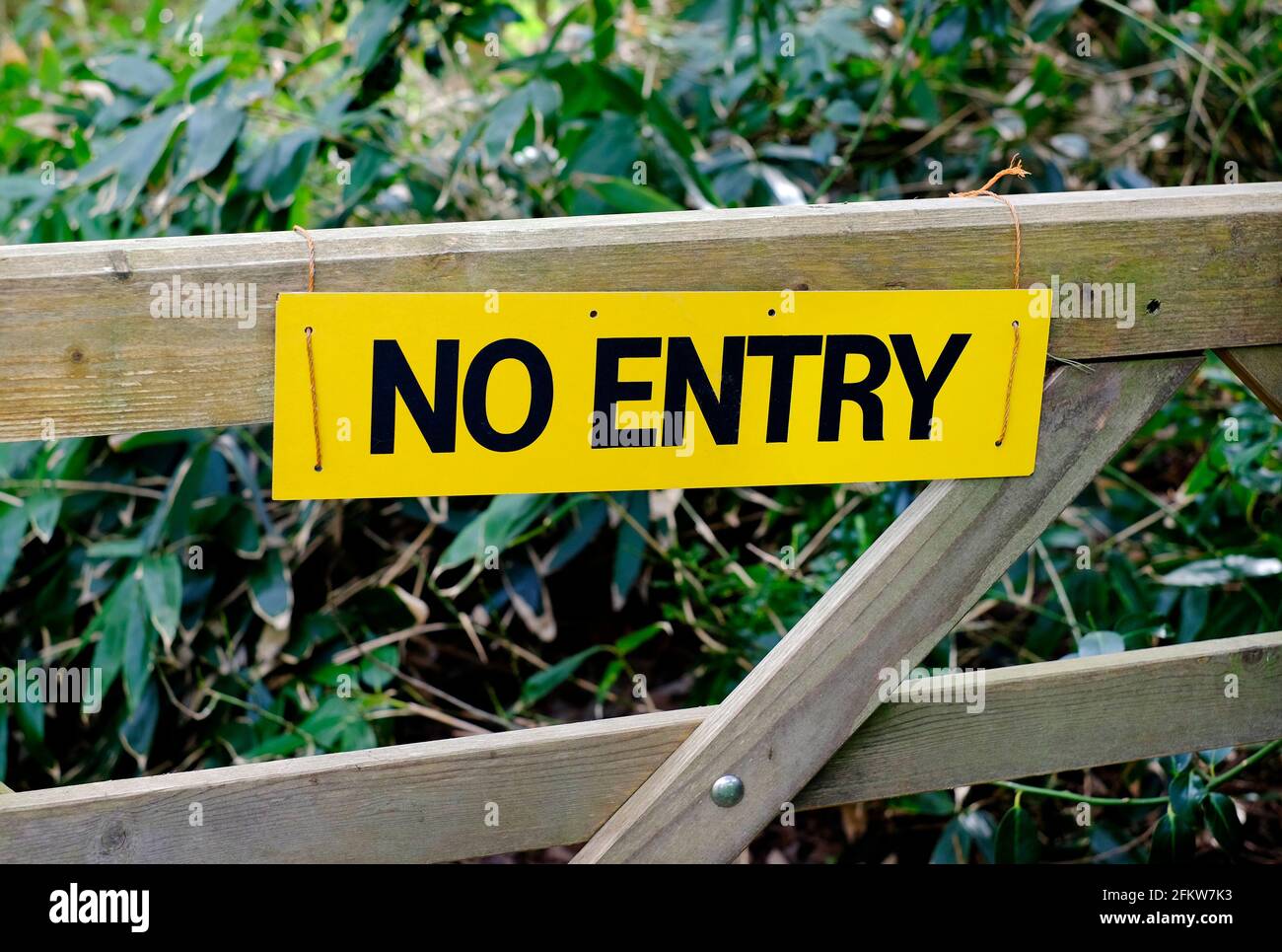 yellow no entry sign on wooden 5 bar gate, norfolk, england Stock Photo