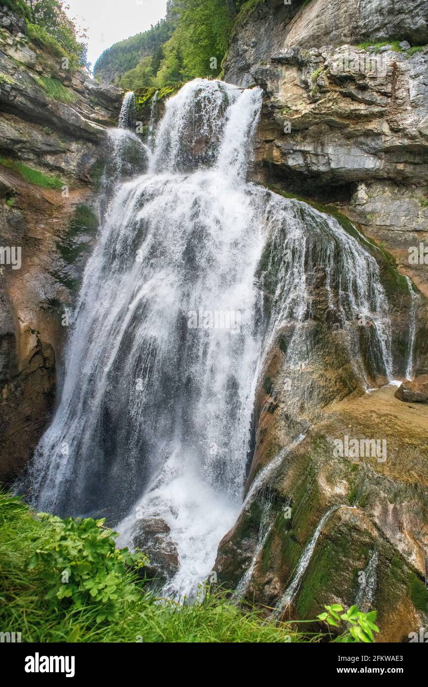 Cola de Caballo waterfall in Ordesa y Monte Perdido National Park, Huesca, Aragon, Spain, Pyrenees mountains. Karst limestone peaks within Ordesa and Stock Photo