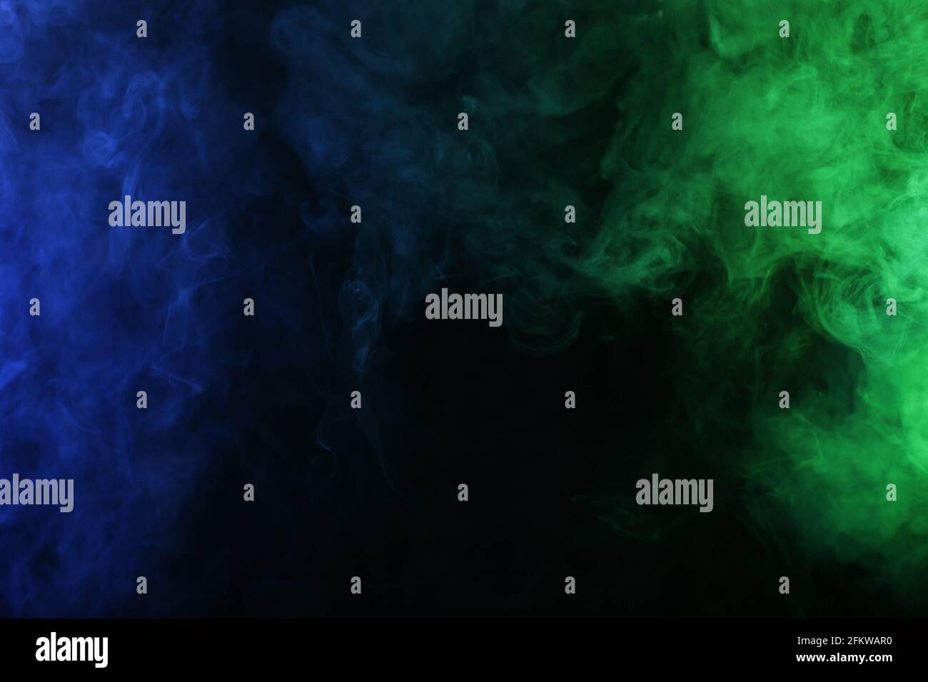 Smoke in blue green light on black background Stock Photo - Alamy