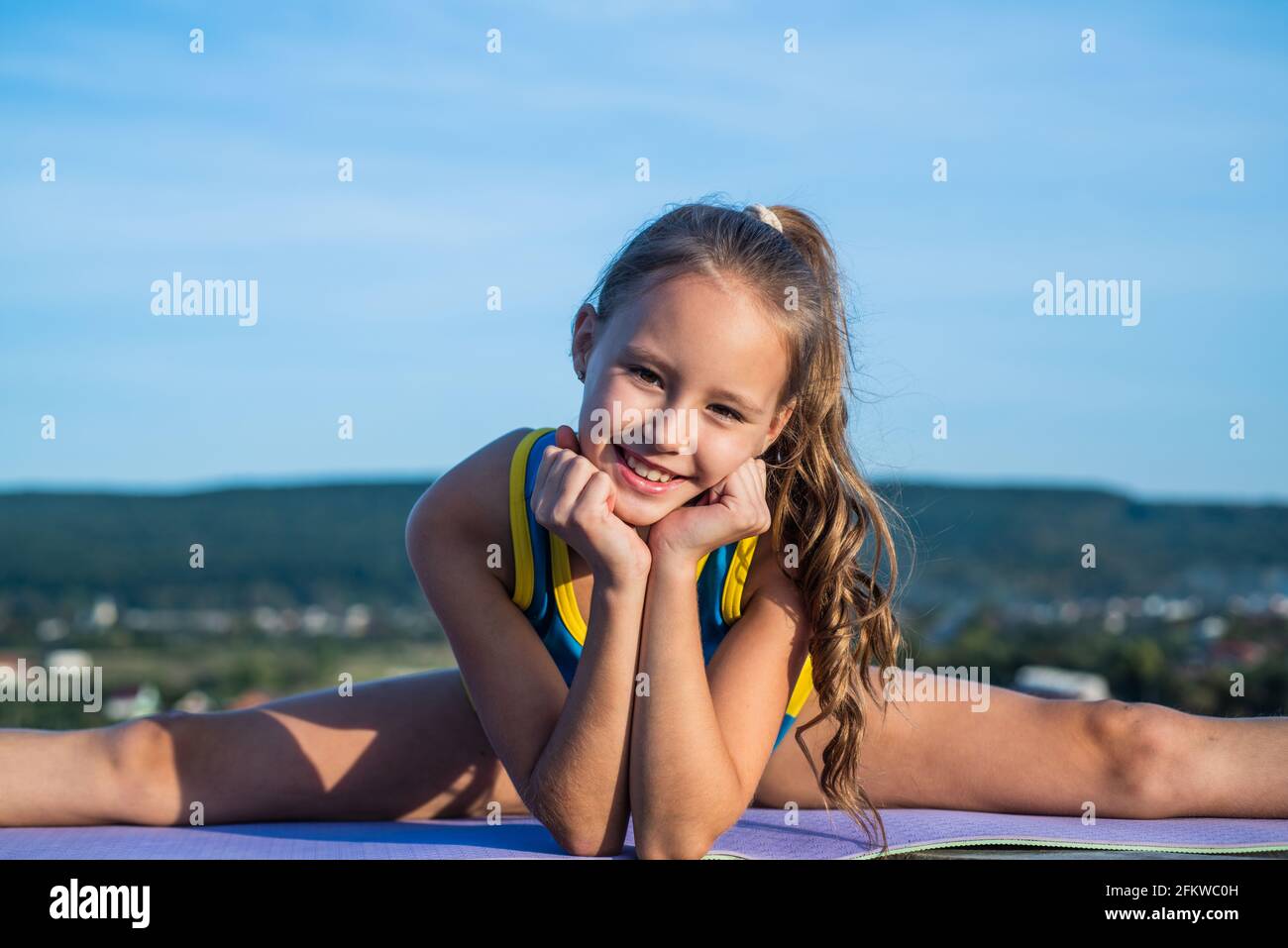 teen girl wear sportswear for training stretching on sky