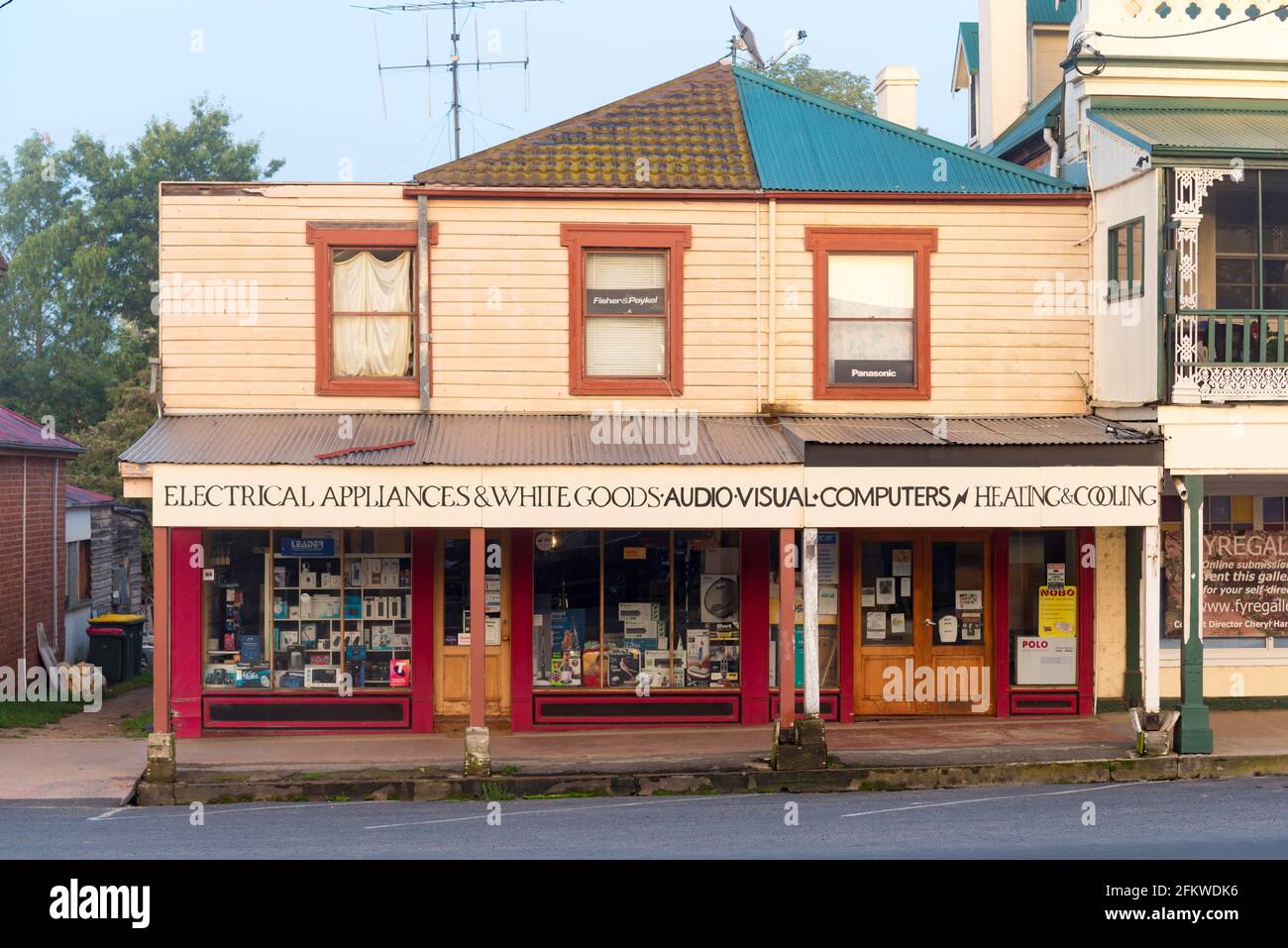 An early 1800's retail store (formally two stores) of brick and timber construction with an interesting roof line, in Braidwood, NSW, Australia Stock Photo