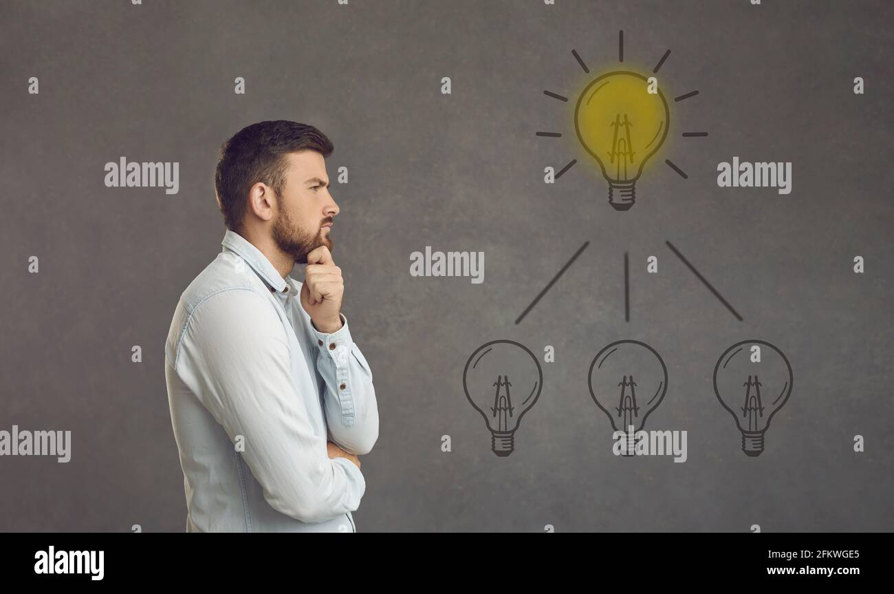 Thinking adult caucasian man try to find idea or problem solution ...