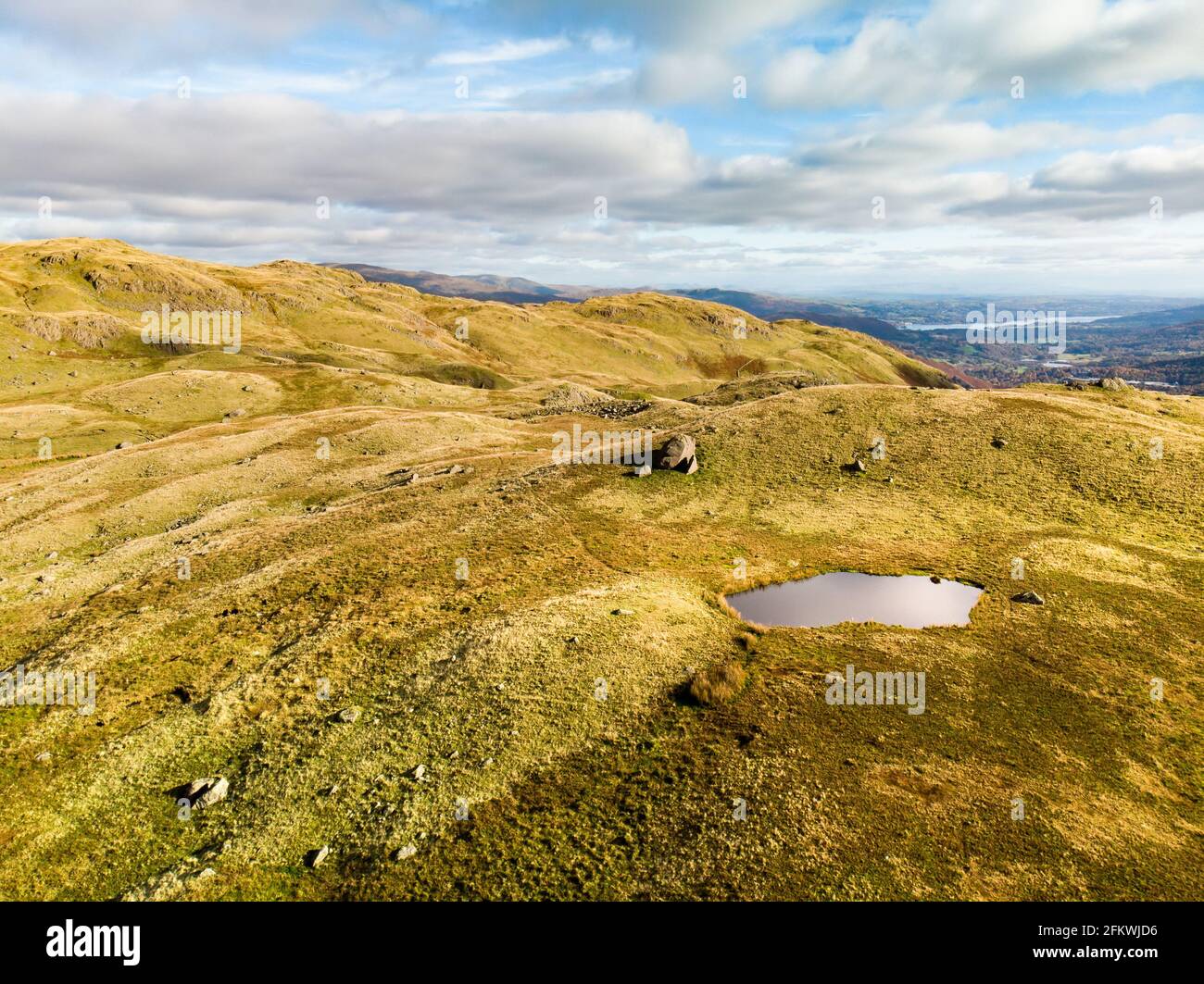 Aerial sunset view of the Lake District, famous for its glacial ribbon lakes and rugged