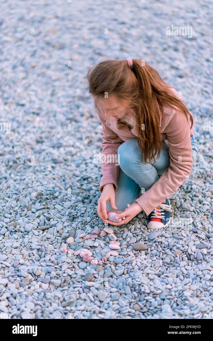 Picking up rocks stones hi-res stock photography and images - Alamy