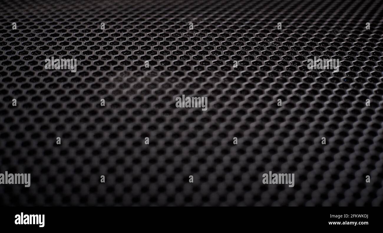 Black grille texture as a background. Stock Photo