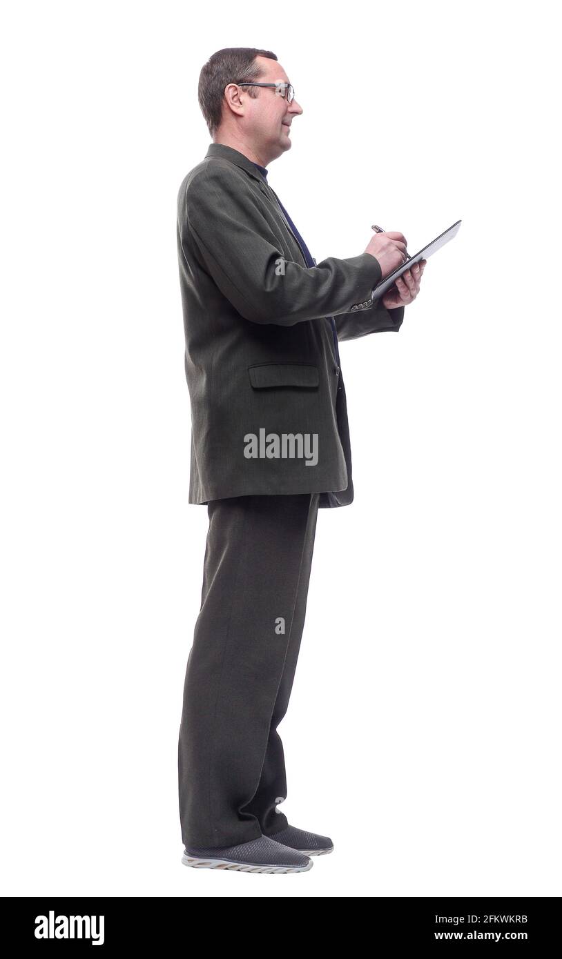 side view . confident man taking notes in the clipboard Stock Photo - Alamy