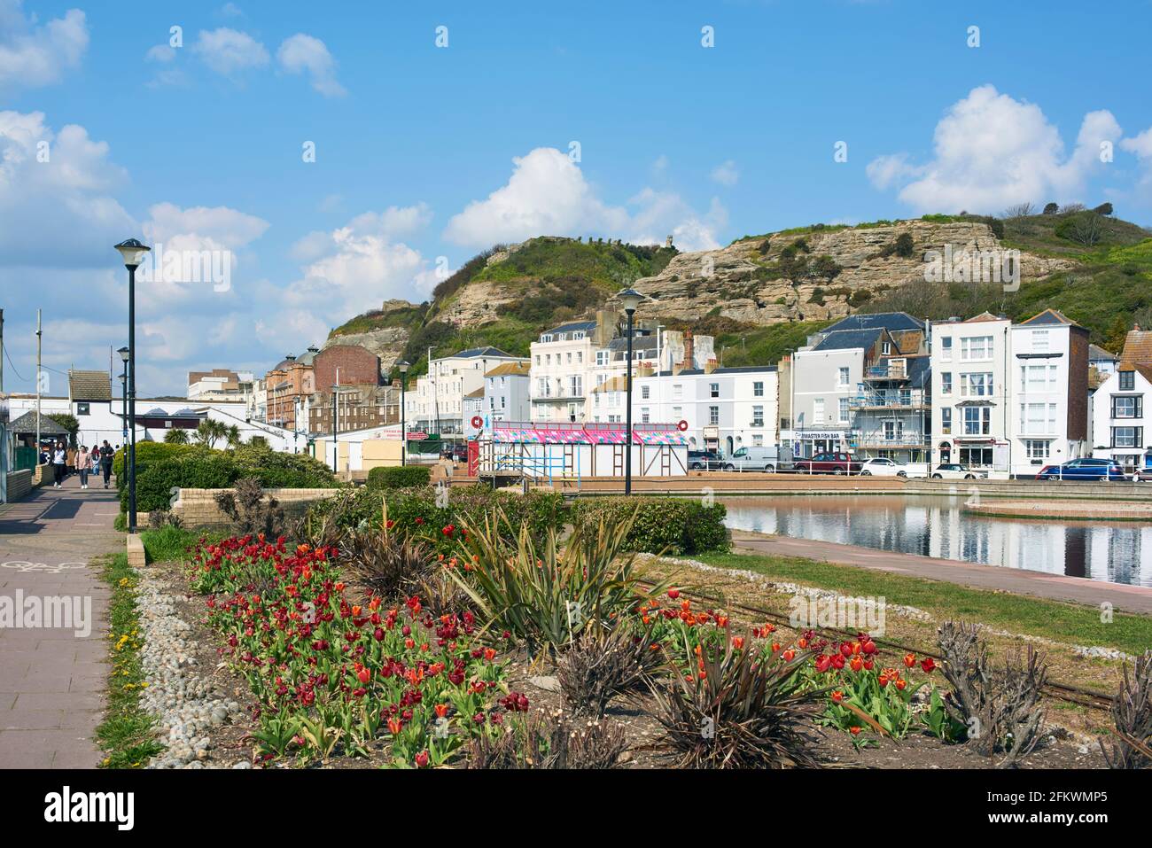 Flowerbeds along Hastings seafront, East Sussex, UK, in springtime, looking towards West Hill Stock Photo