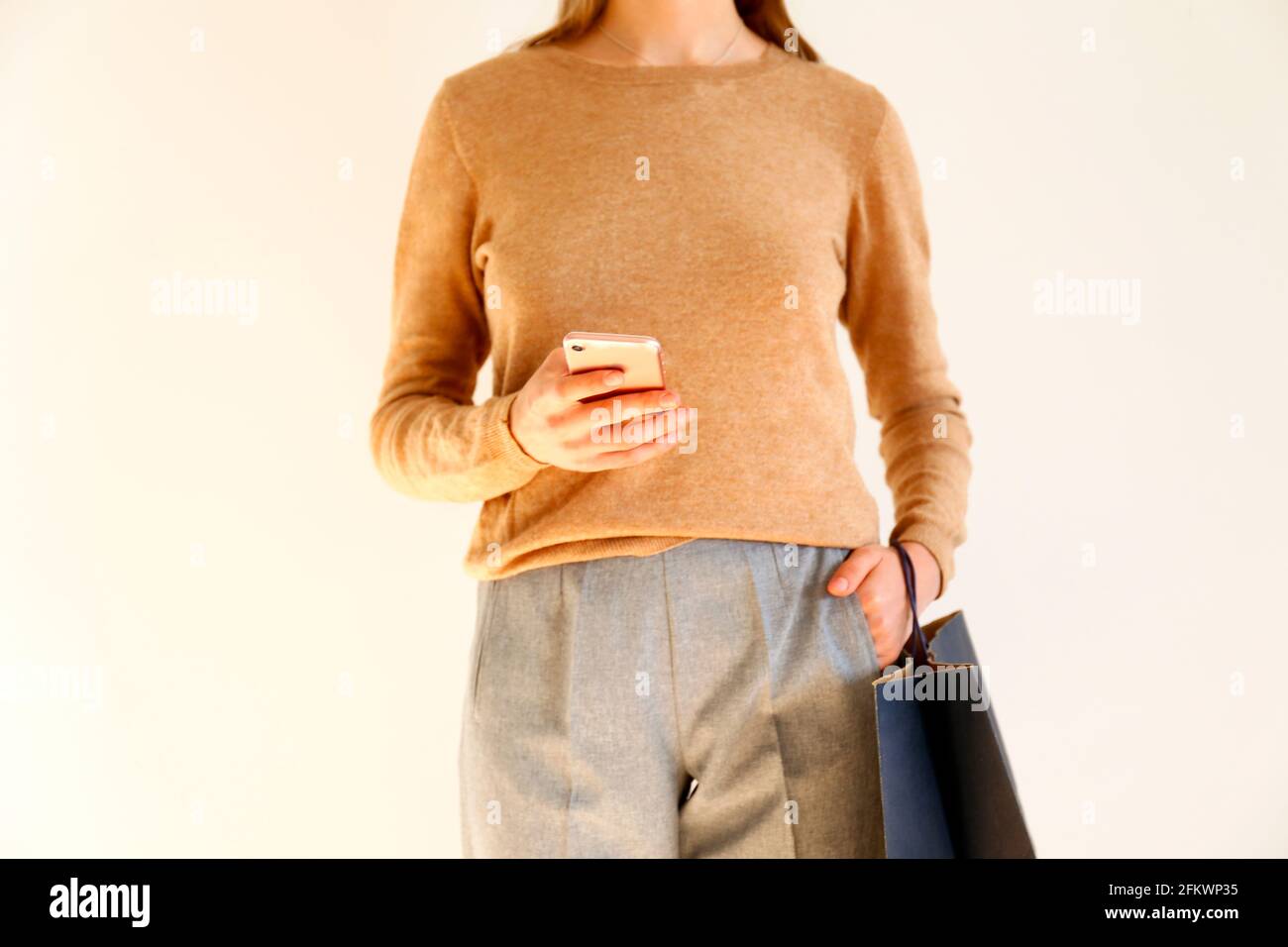 brown sweater gray pants