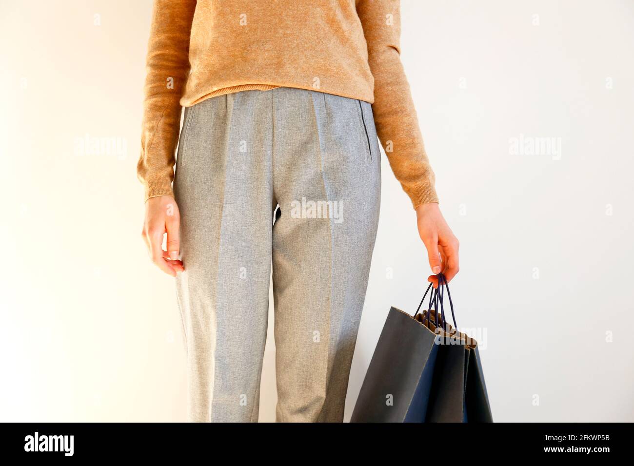 Young slim woman in classic fashionable 