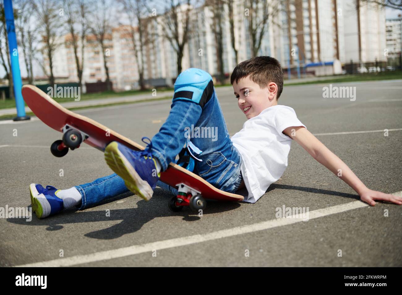 Boy sitting on skateboard hi-res stock photography and images - Page 11 -  Alamy
