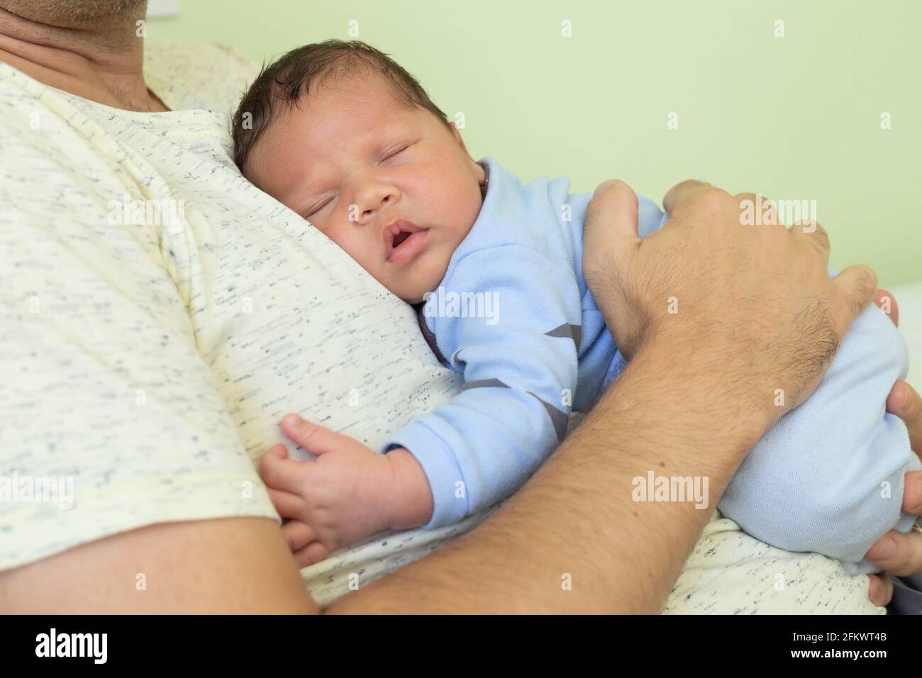 Baby Sleeping Very Relaxed In Blue Clothes In The Lap Of A 40 Year Old Man Stock Photo Alamy Baby Sleeping Very Relaxed In Blue Clothes In The Lap Of A 40 Year Old Man Stock Photo Alamy