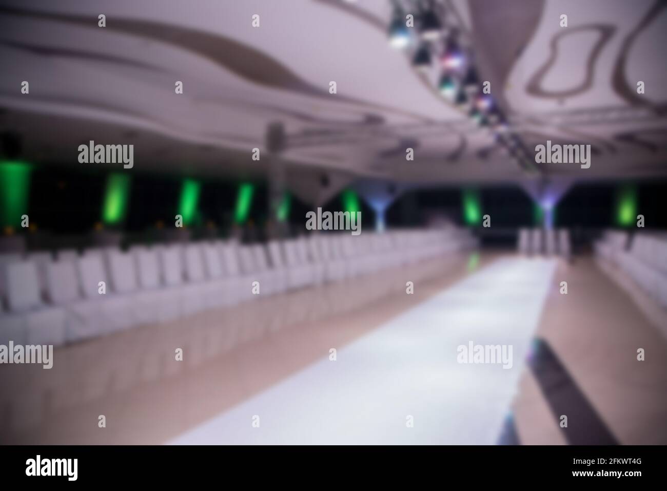 Blurred scene of empty fashion catwalk prepared for fashion show. Stock Photo