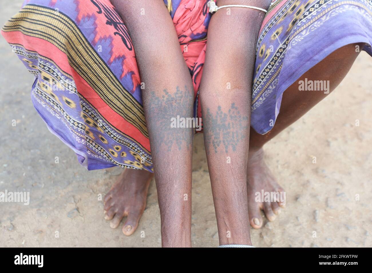 Woman showing tattoos on arm. DESIA KONDHA TRIBE. Goipeta Village, Odisha, India Stock Photo