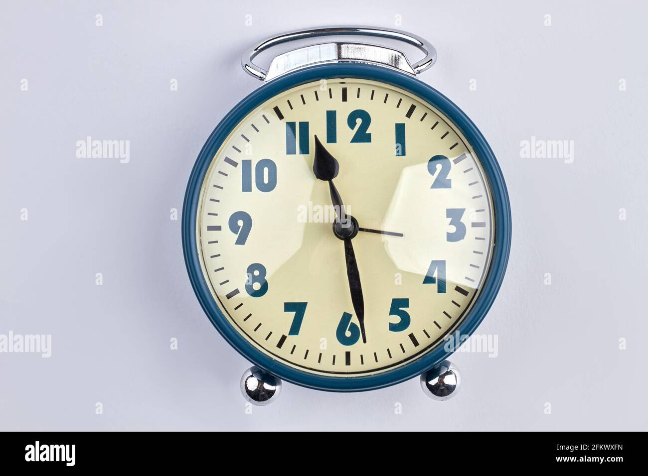 Old-fashioned alarm clock isolated on white background Stock Photo - Alamy