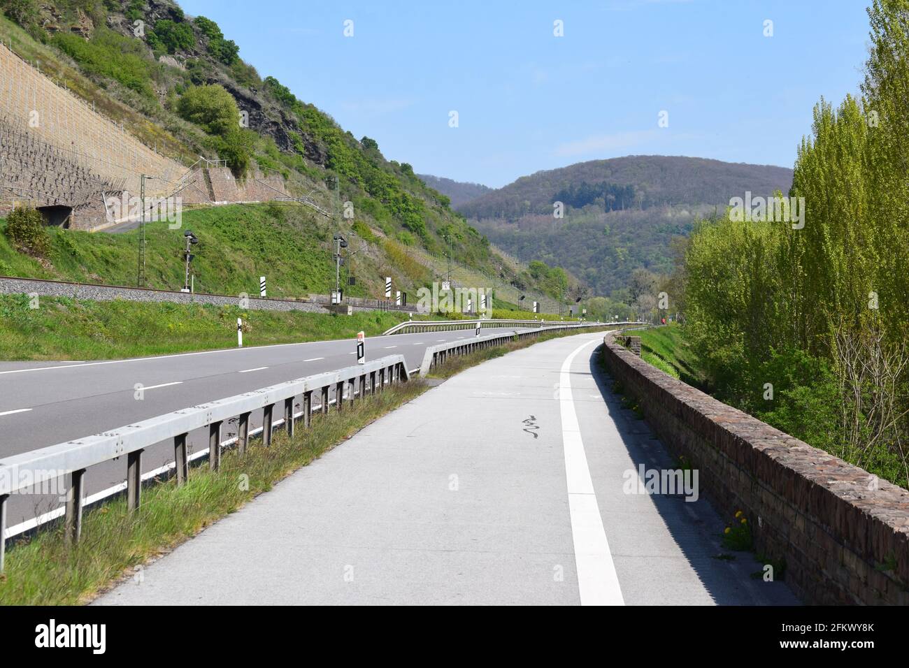 road through Mittelrheintal with railroad alongside Stock Photo