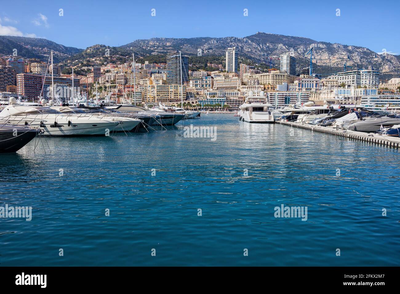 Principality of Monaco city skyline, boats and yachts in Port Hercules Stock Photo
