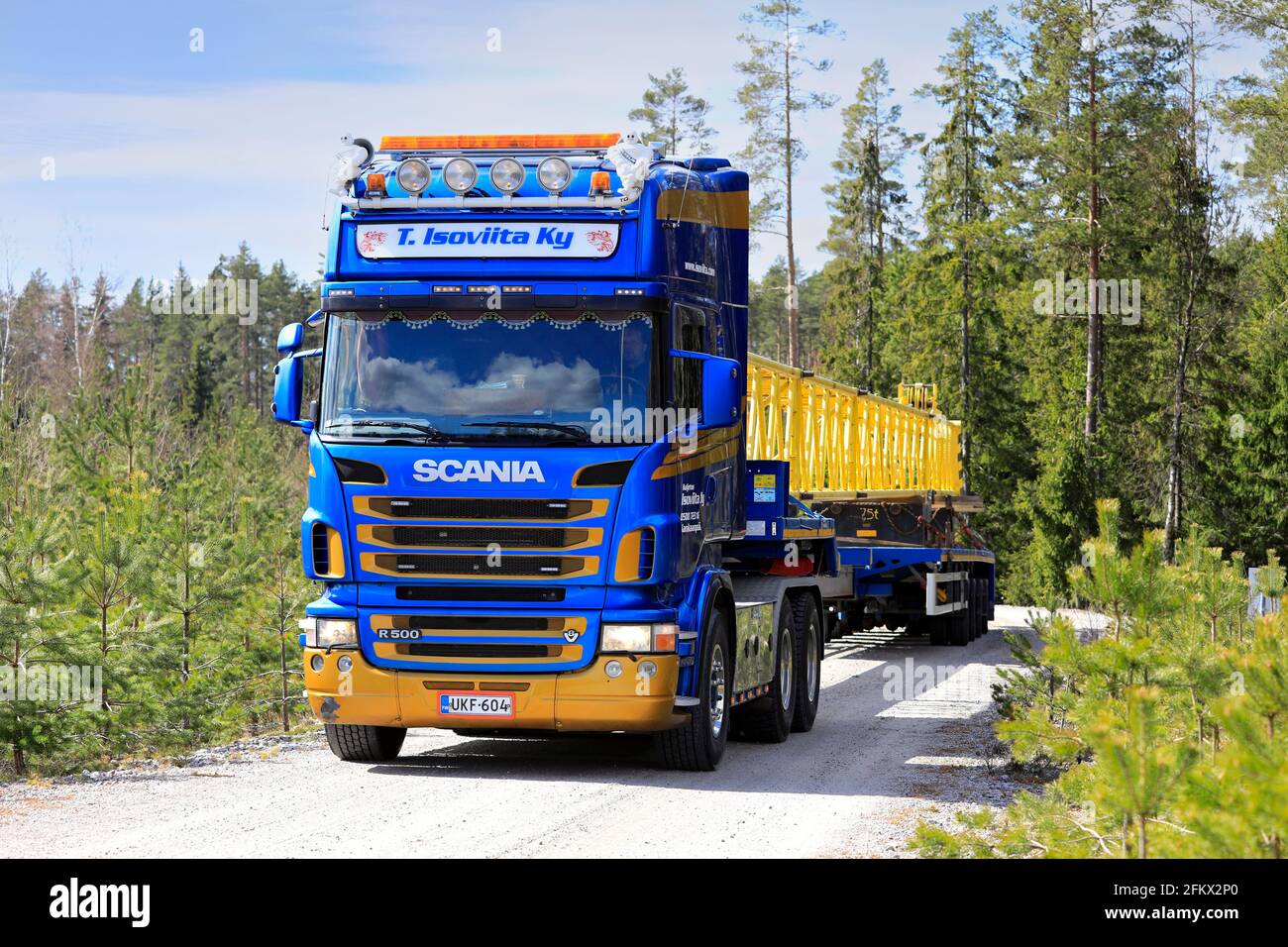 Scania semi trailer of T. Isoviita Ky transports part of service crane for wind turbine blade replacement. Oversize load. Salo, Finland. Apr 30, 2021. Stock Photo