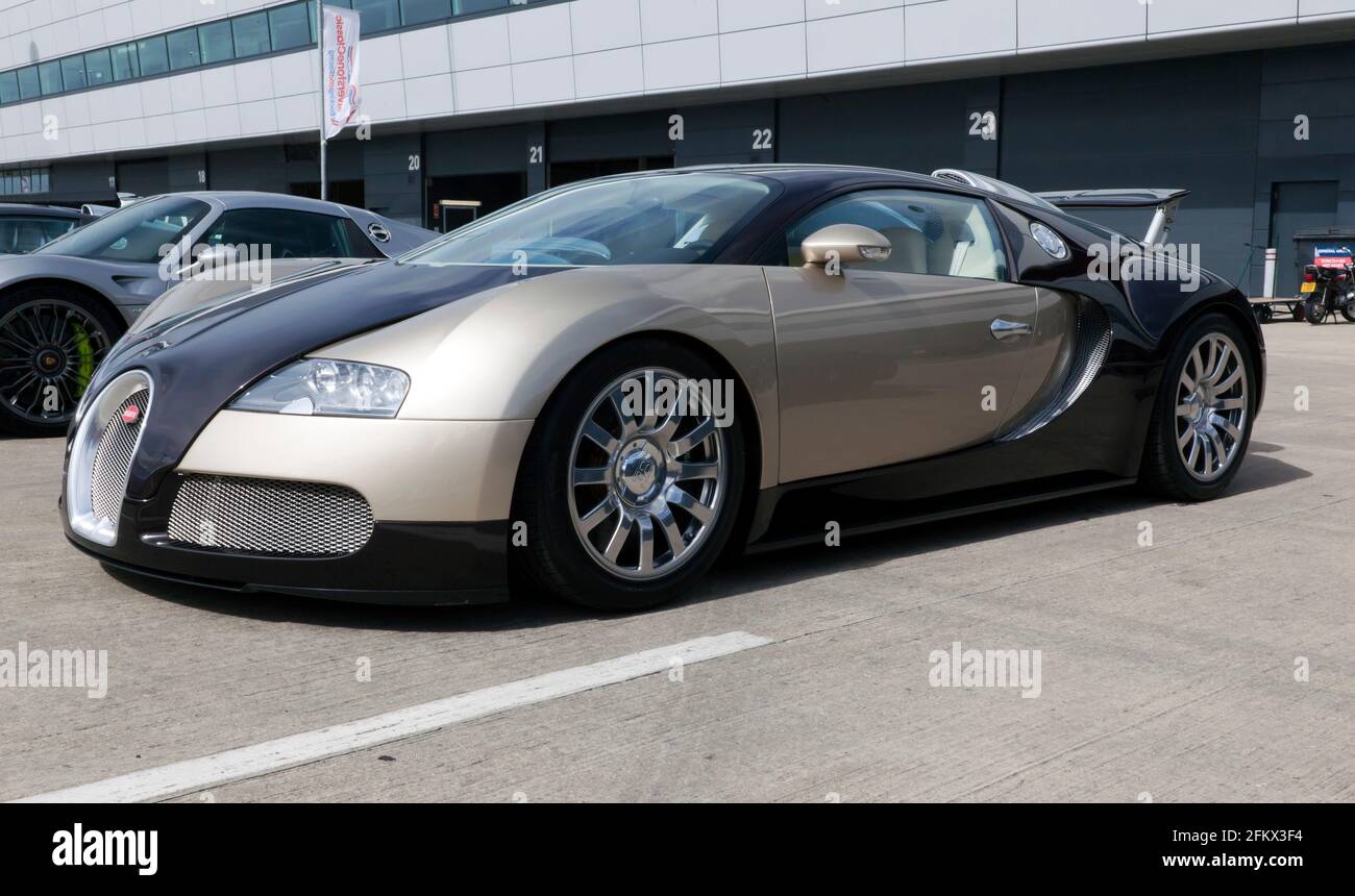 Three-quarter front view of a 2007 Bugatti Veyron EB 16.4 on static display in the International Paddock at the 2017 Silverstone Classic Stock Photo