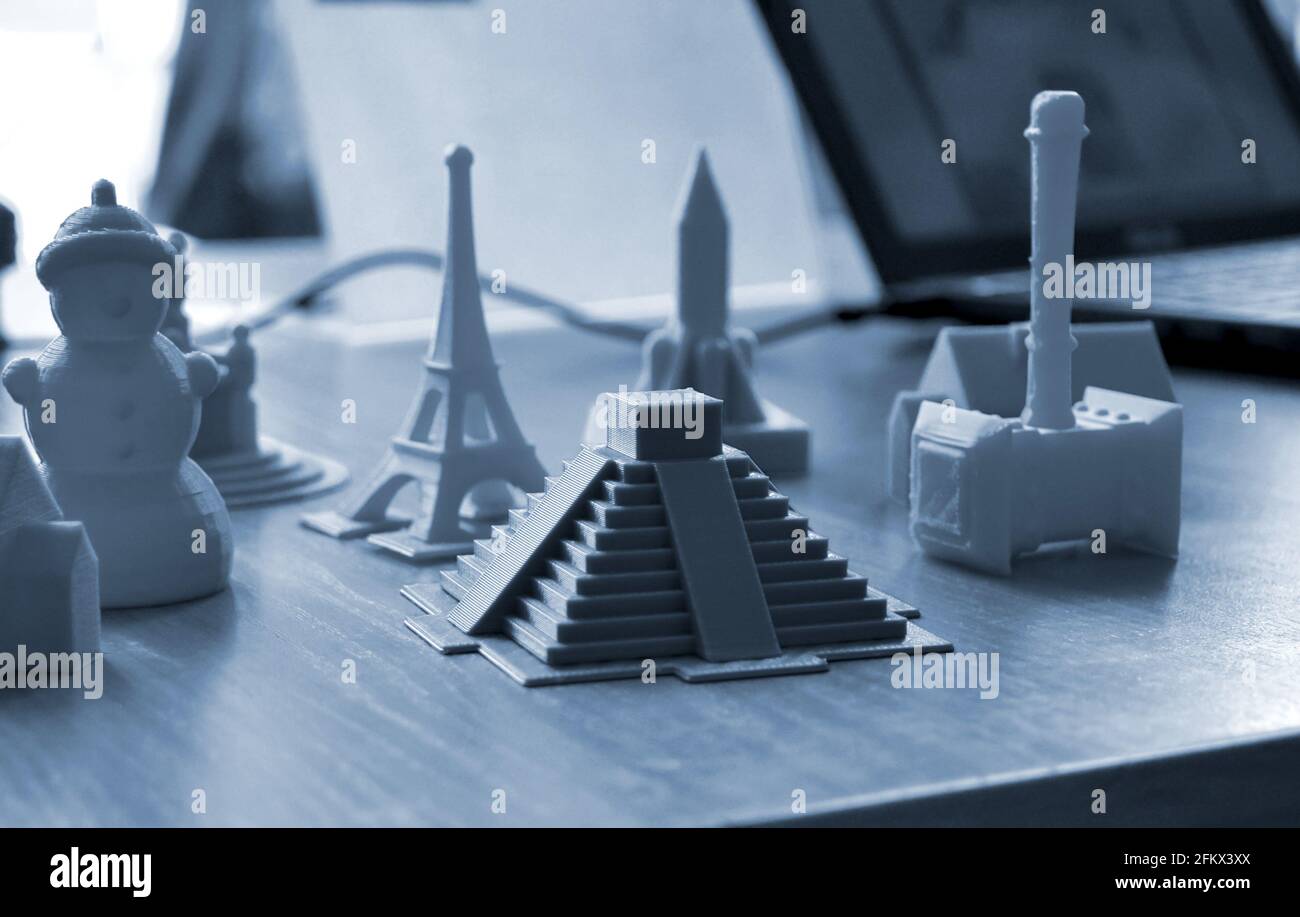 Small prototypes of different objects printed by a 3d printer close-up. Stock Photo