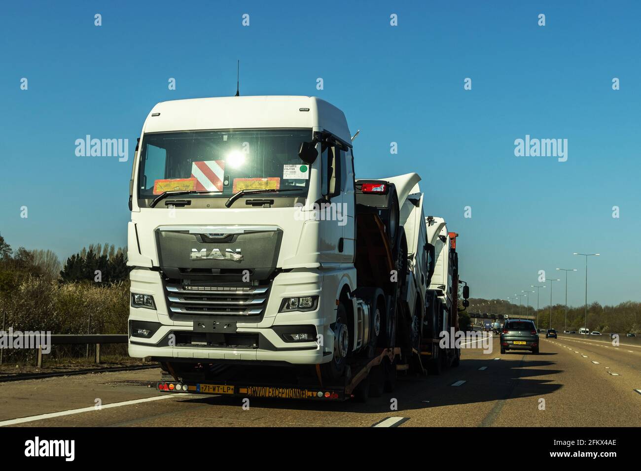 Lorry trailer transporting lorries on a motorway Stock Photo