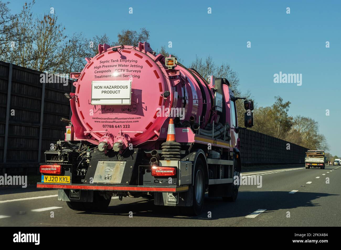 Pink septic tank on a motorway Stock Photo Alamy