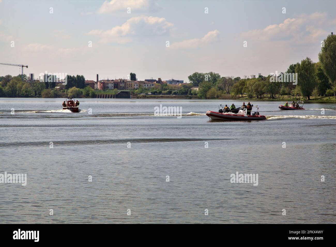 Italian firefighters on boats on a lake during a trianing Stock Photo