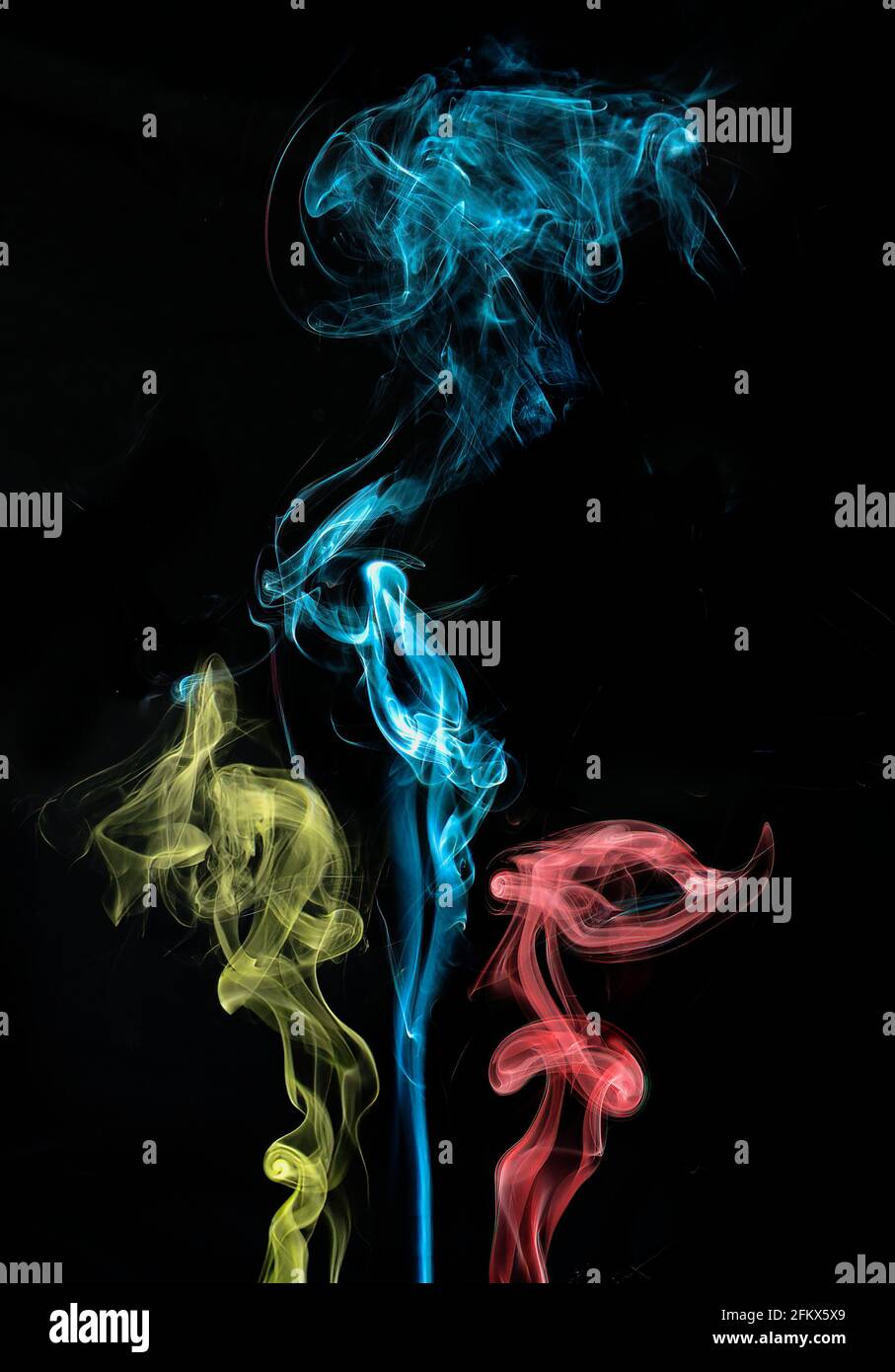 Abstract colorful smoke against a black background Stock Photo - Alamy