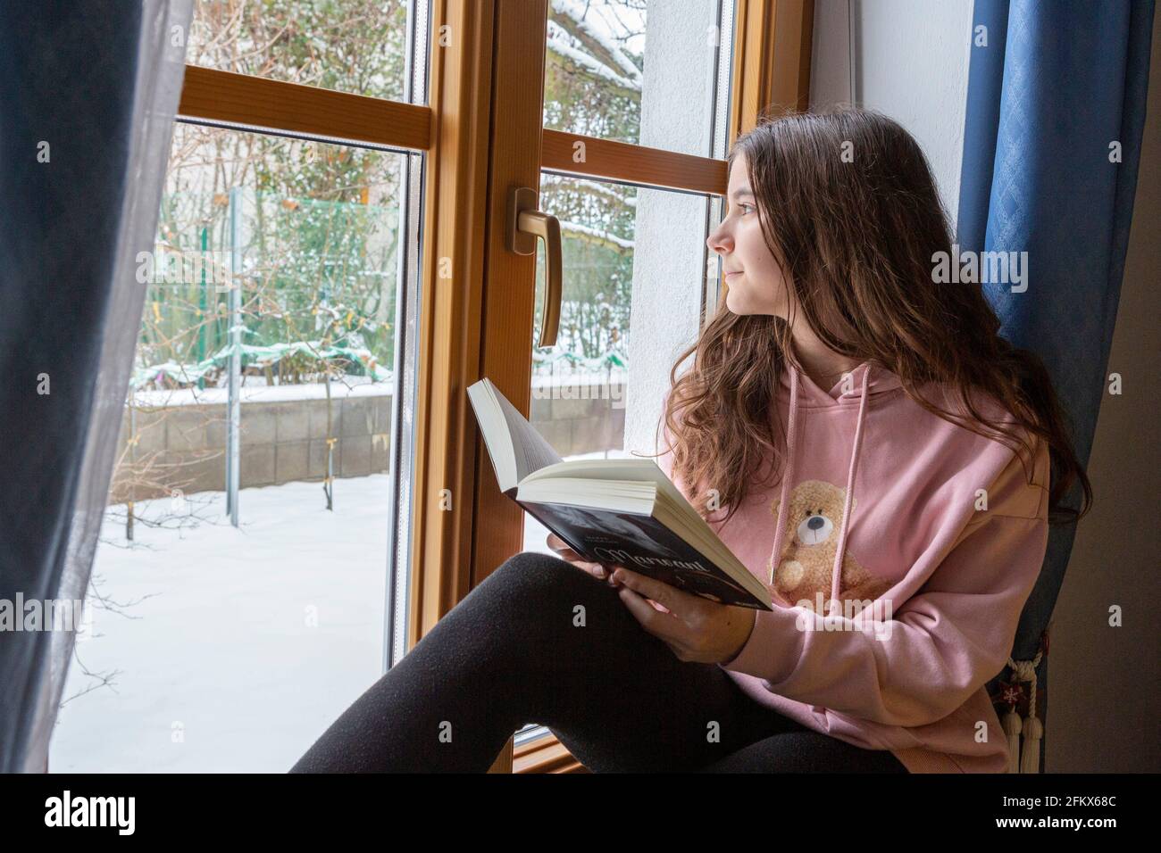 School Girl Reads A Book Stock Photo