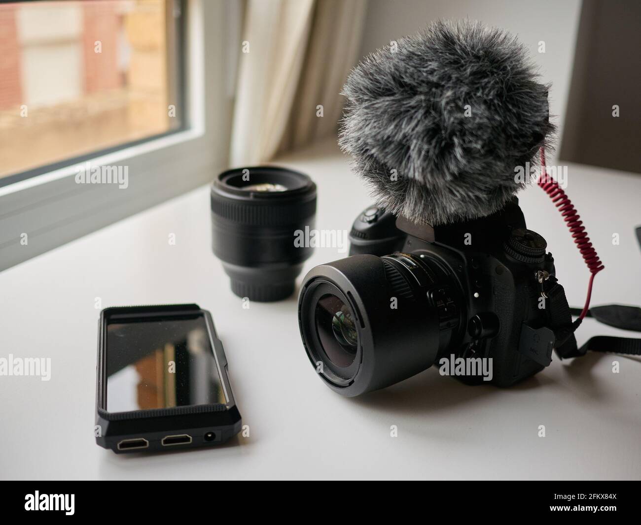 Photo camera on a white table. High quality photo. Stock Photo