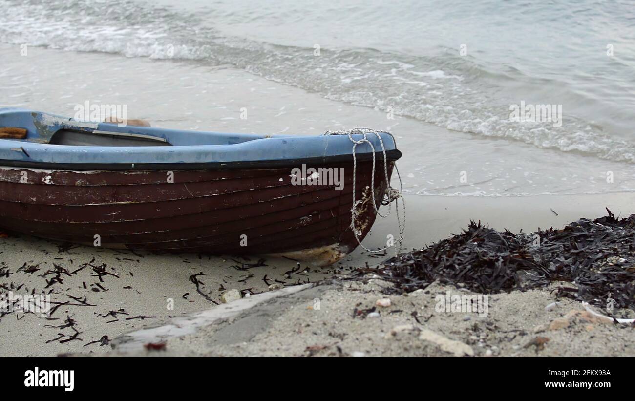 3D illustration - fishing boat lie down on a beach Stock Photo - Alamy