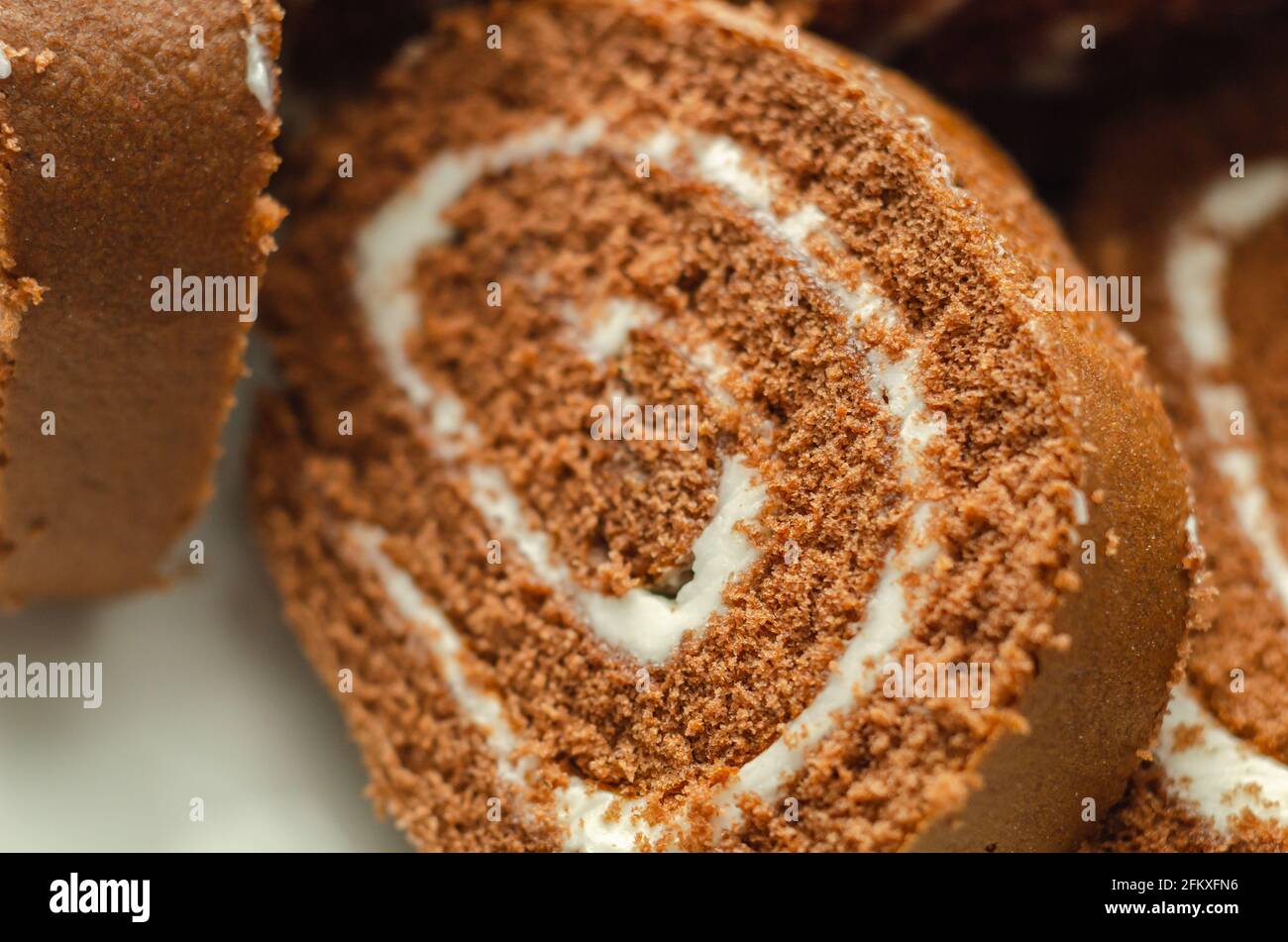 Chocolate sponge roll with a vanilla flavour filling, chocolate swiss