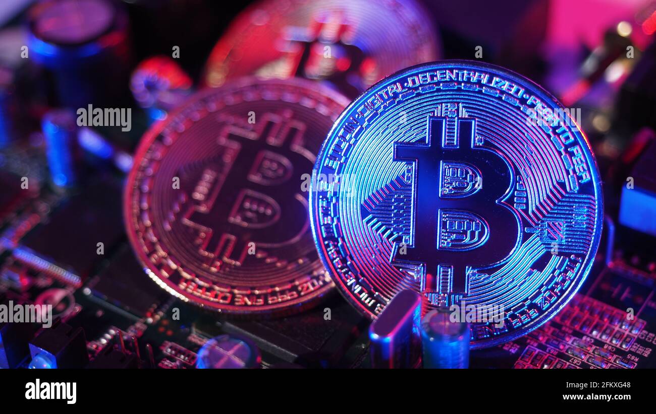 Bitcoin on circuit board. Cryptocurrency bit-coins and computer mainboard.  Digital money currency bitcoins or BTC and cyber micro chip. Pink blue colo  Stock Photo - Alamy